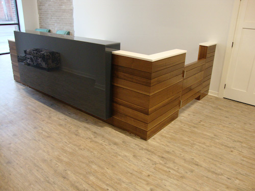 A wider view of the reception service counter at Blue Hills Chiropractic.